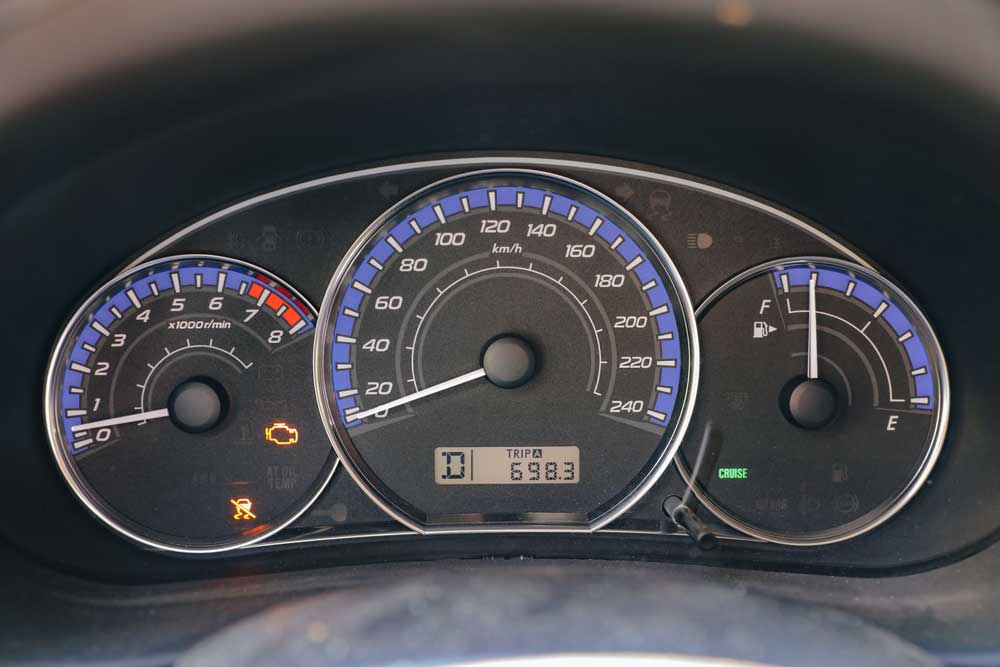 Car dashboard showing check engine light
